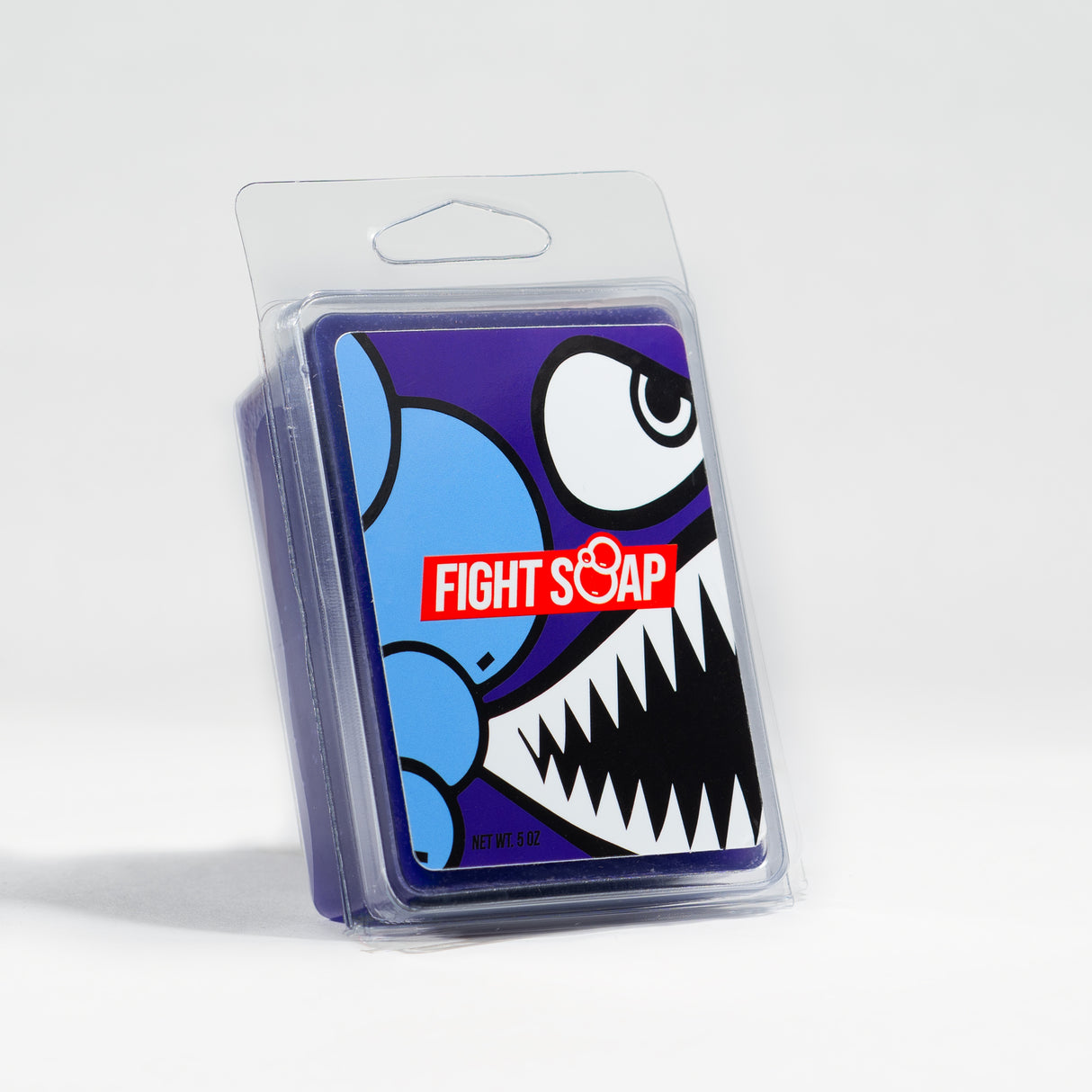 A colorful cartoon-style character with sharp teeth and large eye, featuring a "Fight Soap" label on a clear plastic package.
