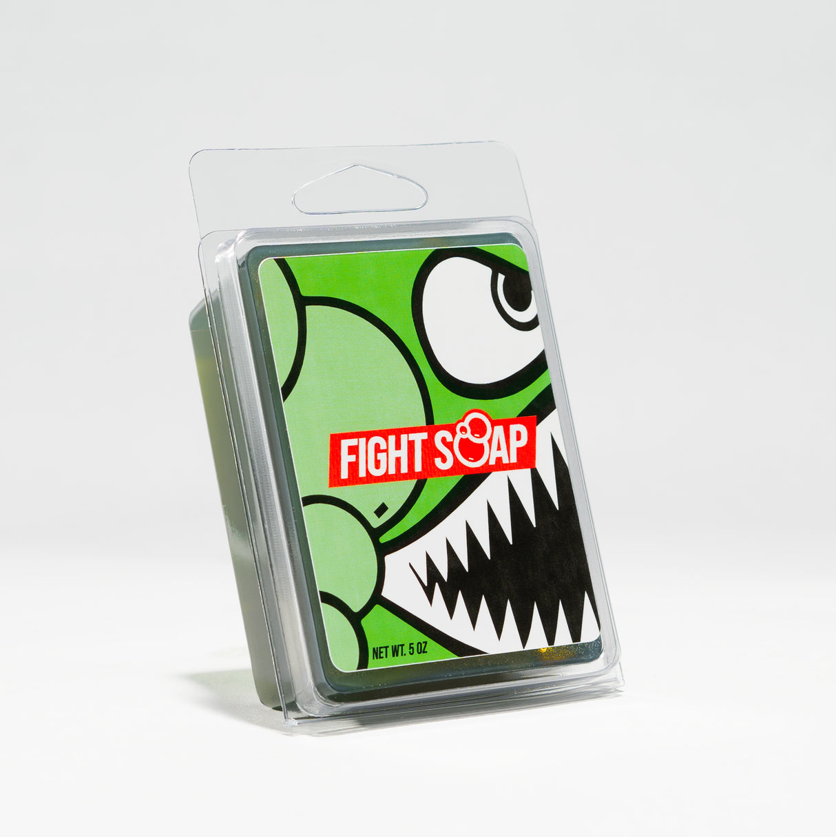 A green cartoon character with sharp teeth and large eyes on a soap package labeled "Fight Soap," in a clear plastic case.