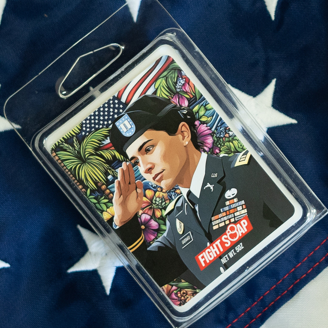 Colorful soap bar featuring a military woman in uniform saluting, with vibrant floral and patriotic background design.