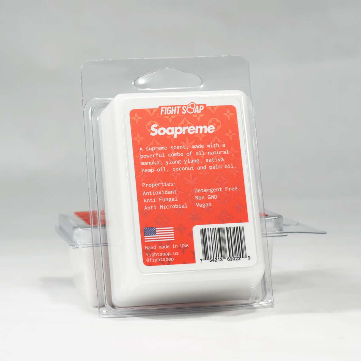 Bar of Fight Soap named Soapreme with a red label detailing natural ingredients, properties, and made in the USA.