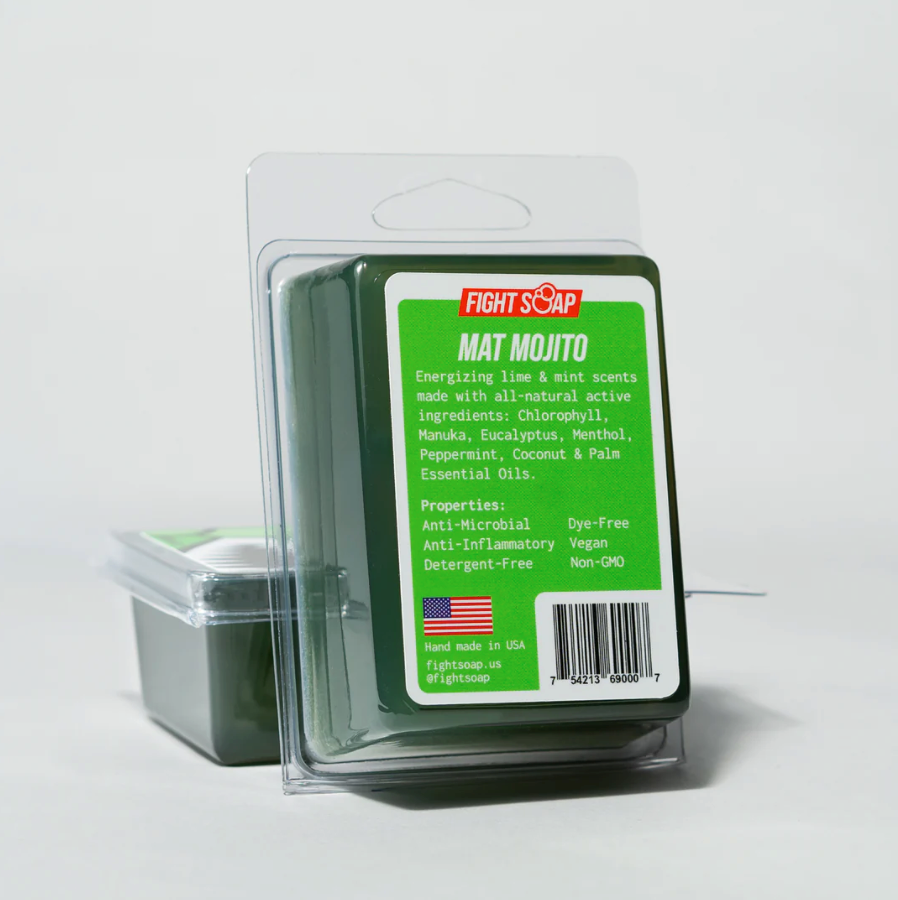 Green and black Fight Soap "Mat Mojito" soap bar in clear plastic packaging with a green label, highlighting natural ingredients and properties.