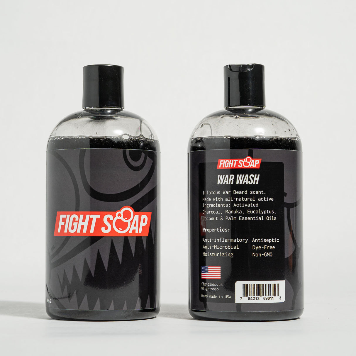 Two bottles of Fight Soap Fighter Bundle, one with a shark design and the other labeled War Wash with natural ingredients.