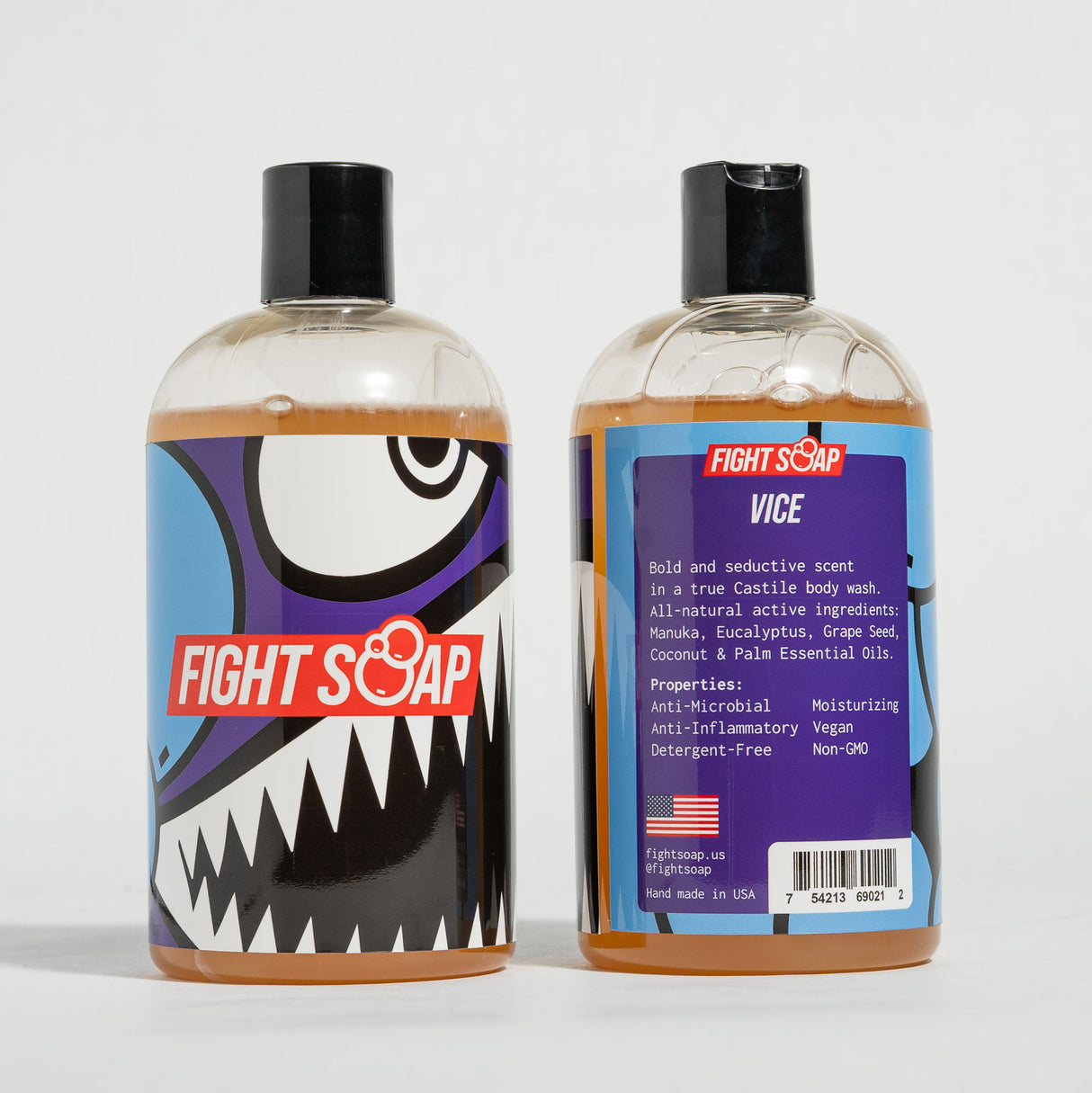 Two bottles of Fight Soap Vice Body Wash with bold, colorful shark-themed labels and black flip-top caps, set against a plain background.