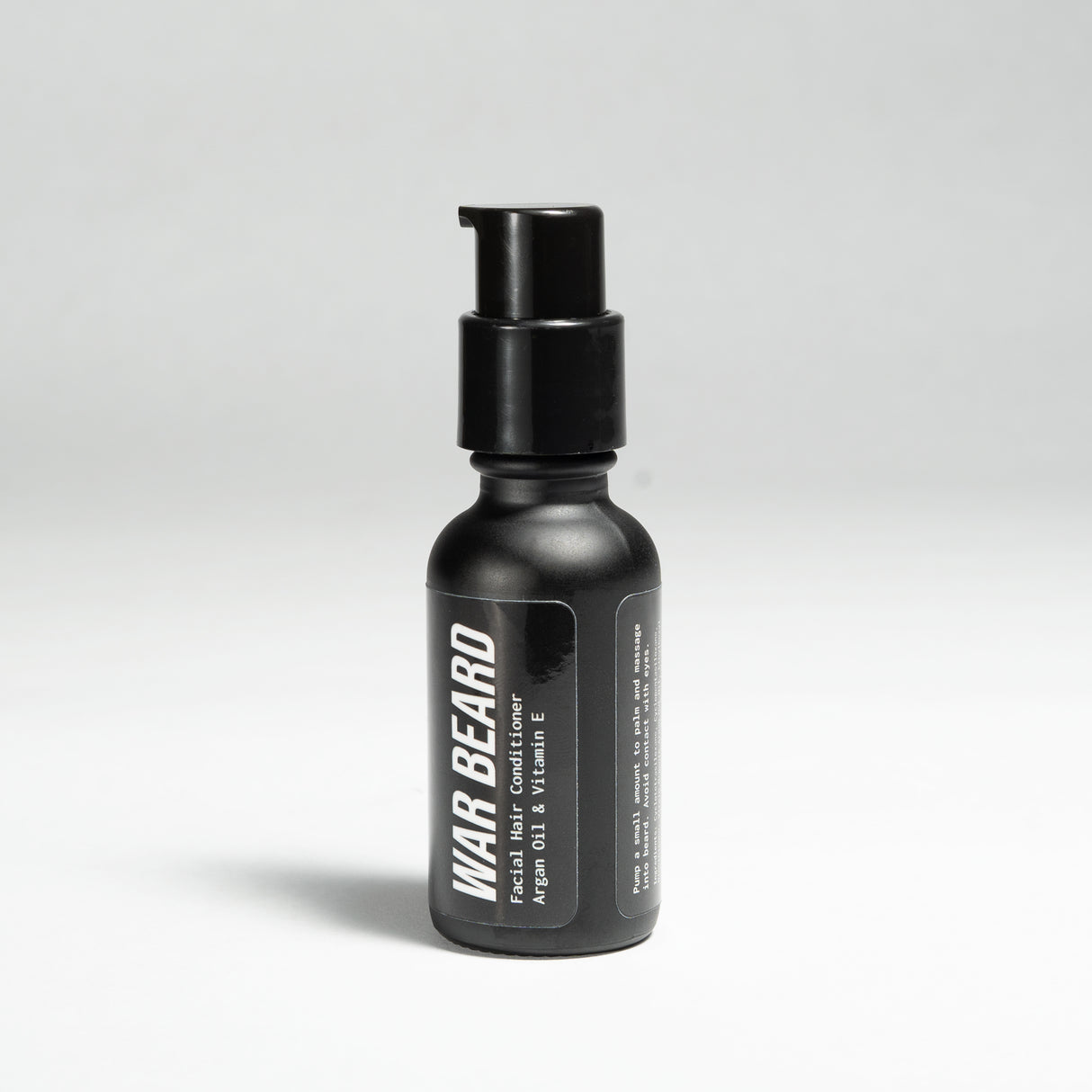 Black WAR BEARD facial hair conditioner bottle with pump, designed for beard grooming and care.